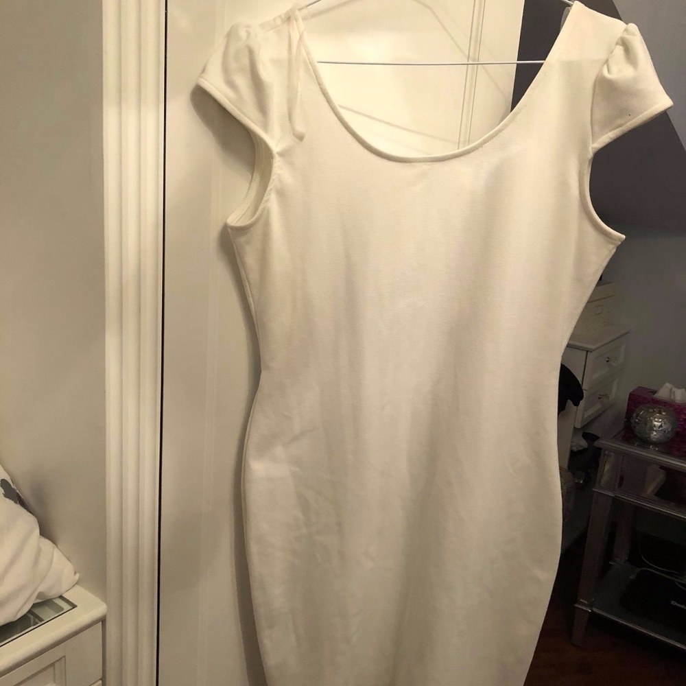 White dress with low back and bow details